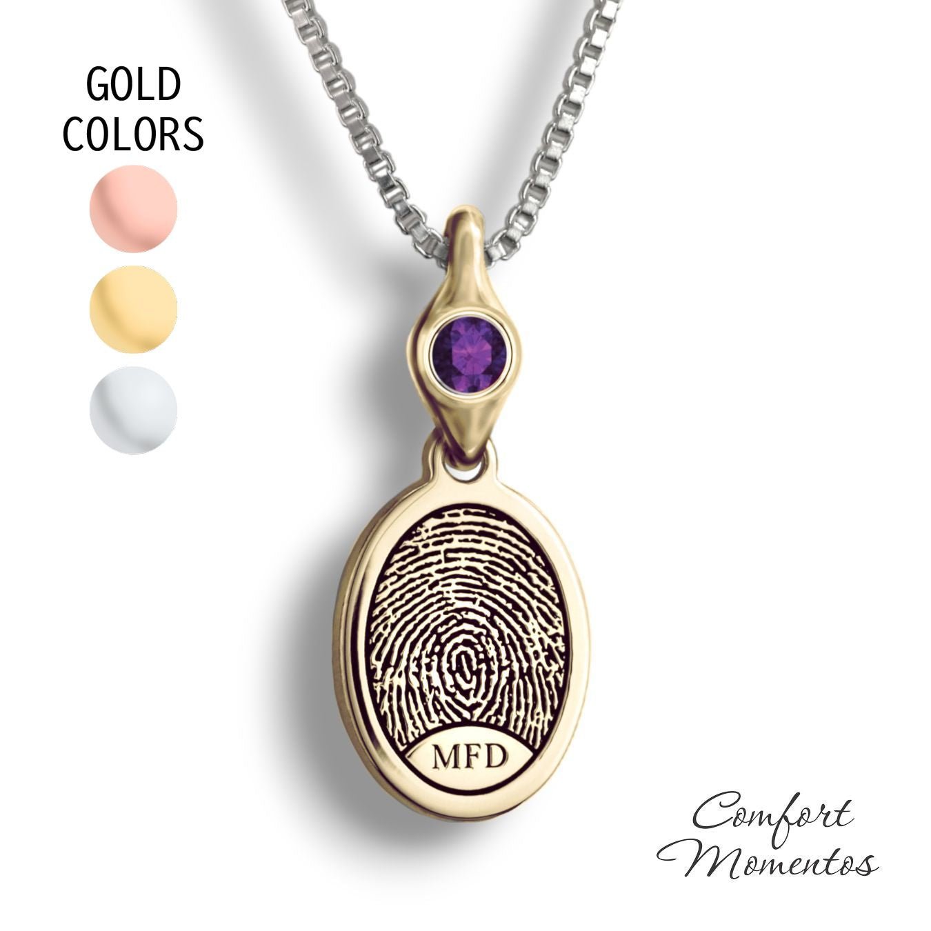 Small gold oval necklace with a black fingerprint and initials engraved, with a gemstone urn