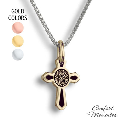 Small gold cross necklace with black fingerprint and recessed black areas