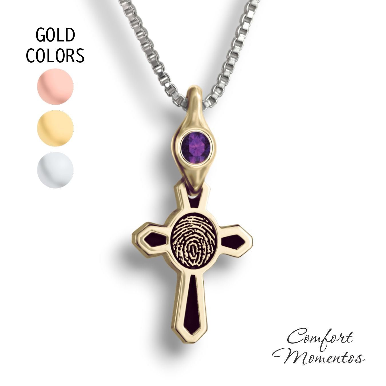 Small gold cross necklace with black fingerprint and recessed black areas, with a gemstone urn