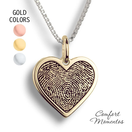 Gold heart necklace with a black fingerprint engraved
