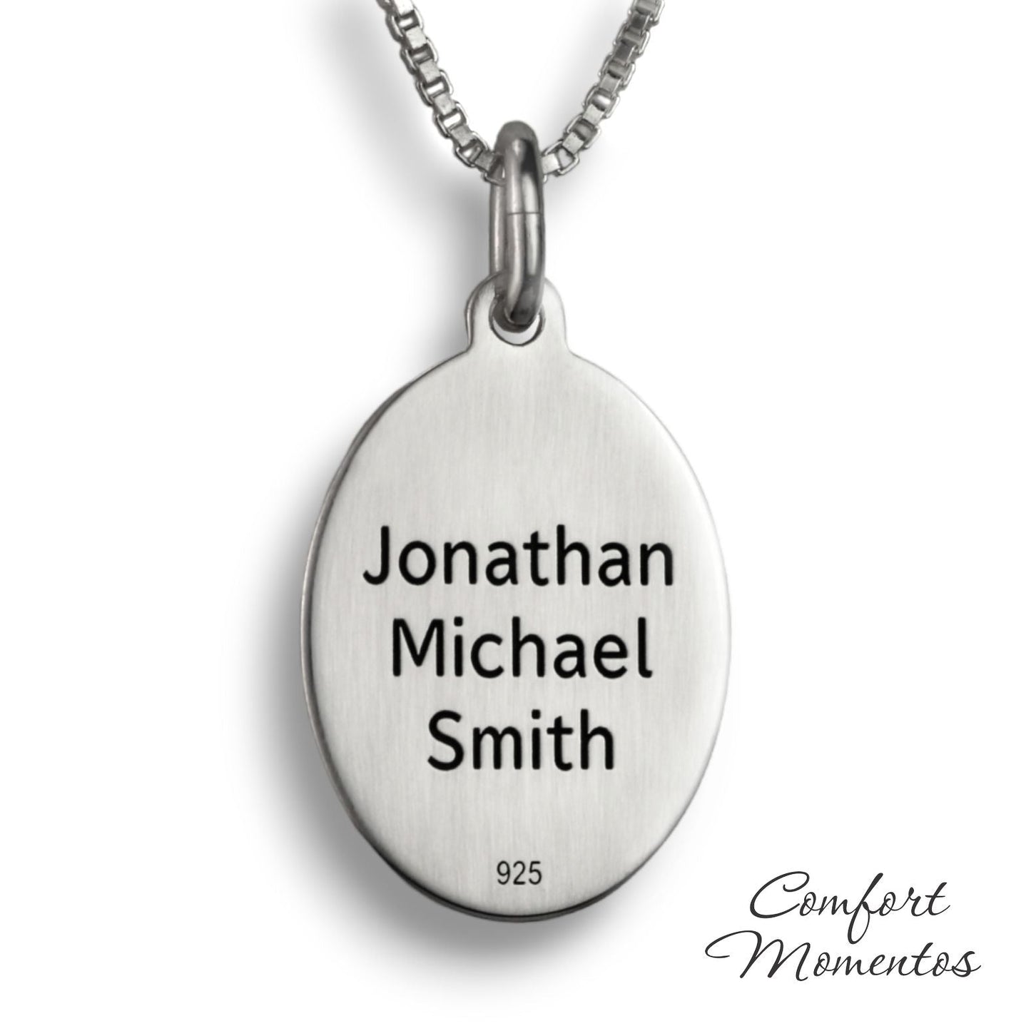 Back of silver oval necklace, with black example text engraved