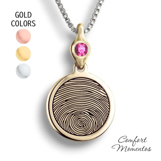 Gold round necklace with a black fingerprint engraved, with a gemstone urn