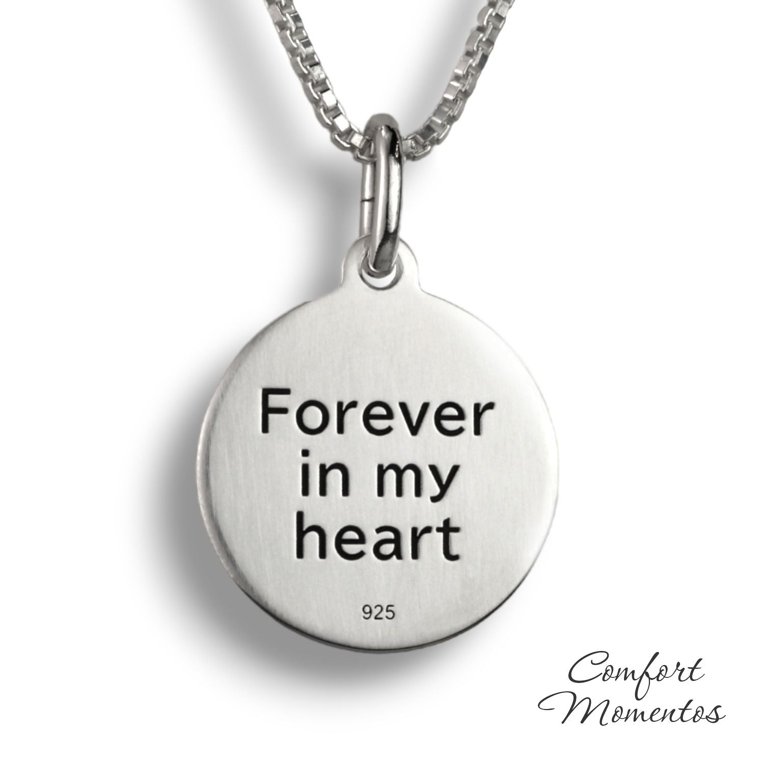 Back of silver round necklace, with black example text engraved