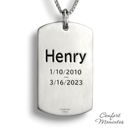Back of large silver dog tag necklace, with black example text engraved
