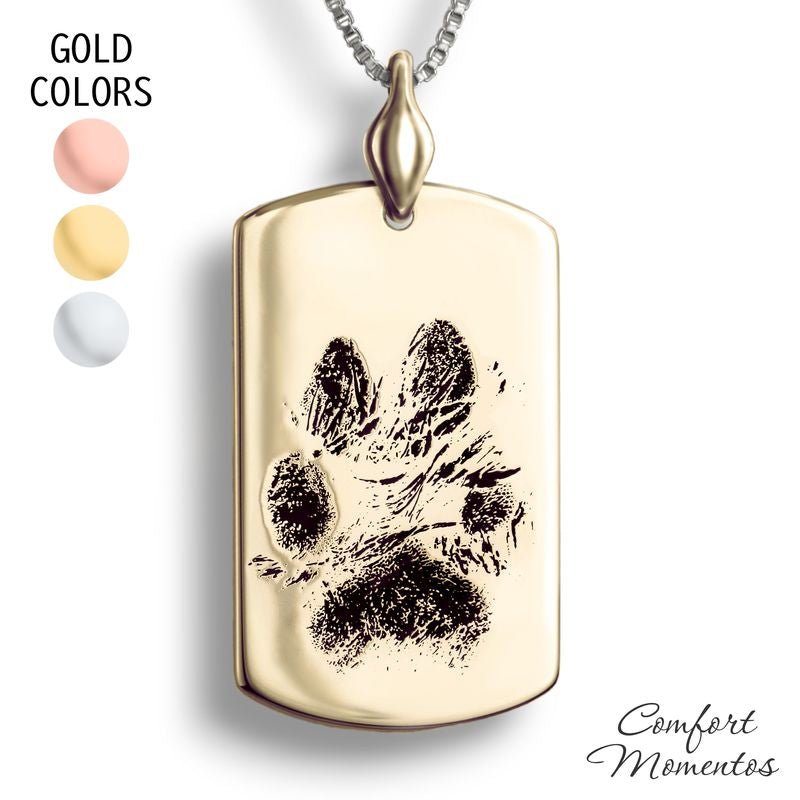 Large gold dog tag necklace with black pawprint engraving, with a plain urn