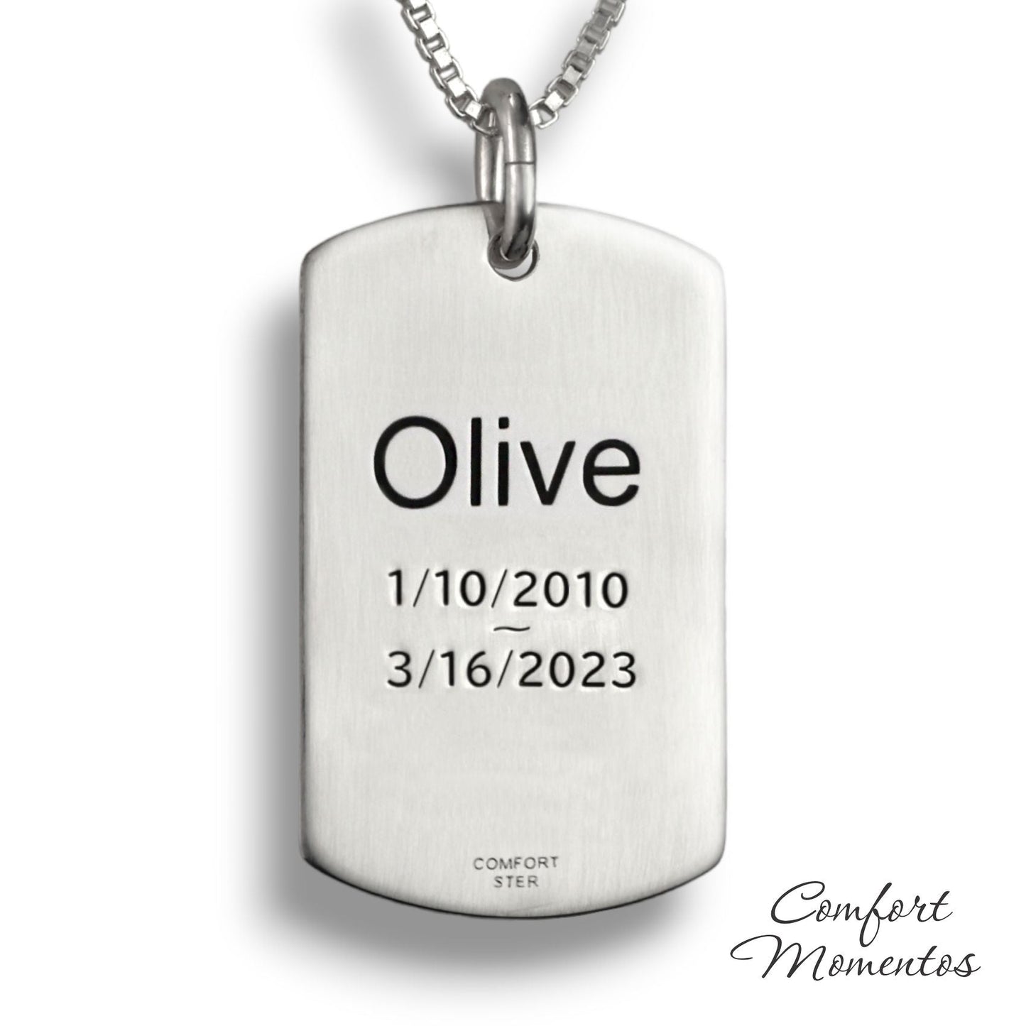 Back of silver dog tag necklace, with black example text engraved
