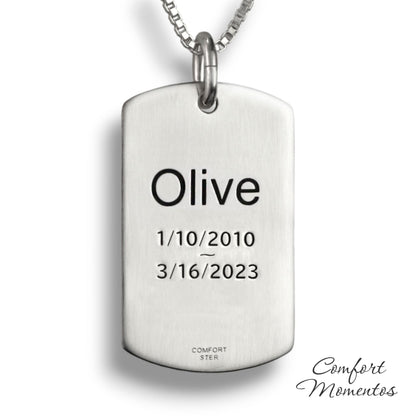 Back of silver dog tag necklace, with black example text engraved