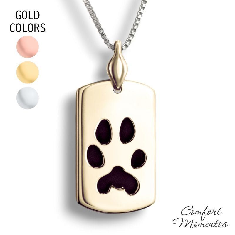 Gold dog tag necklace with black pawprint engraving, with a plain urn