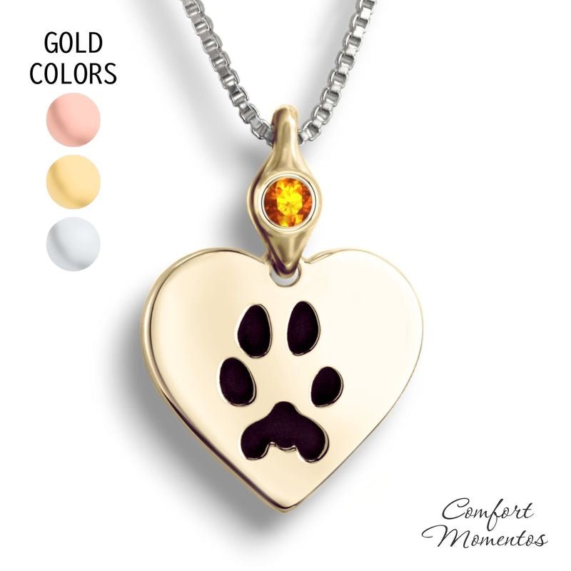 Gold heart necklace with black pawprint engraving, with a gemstone urn