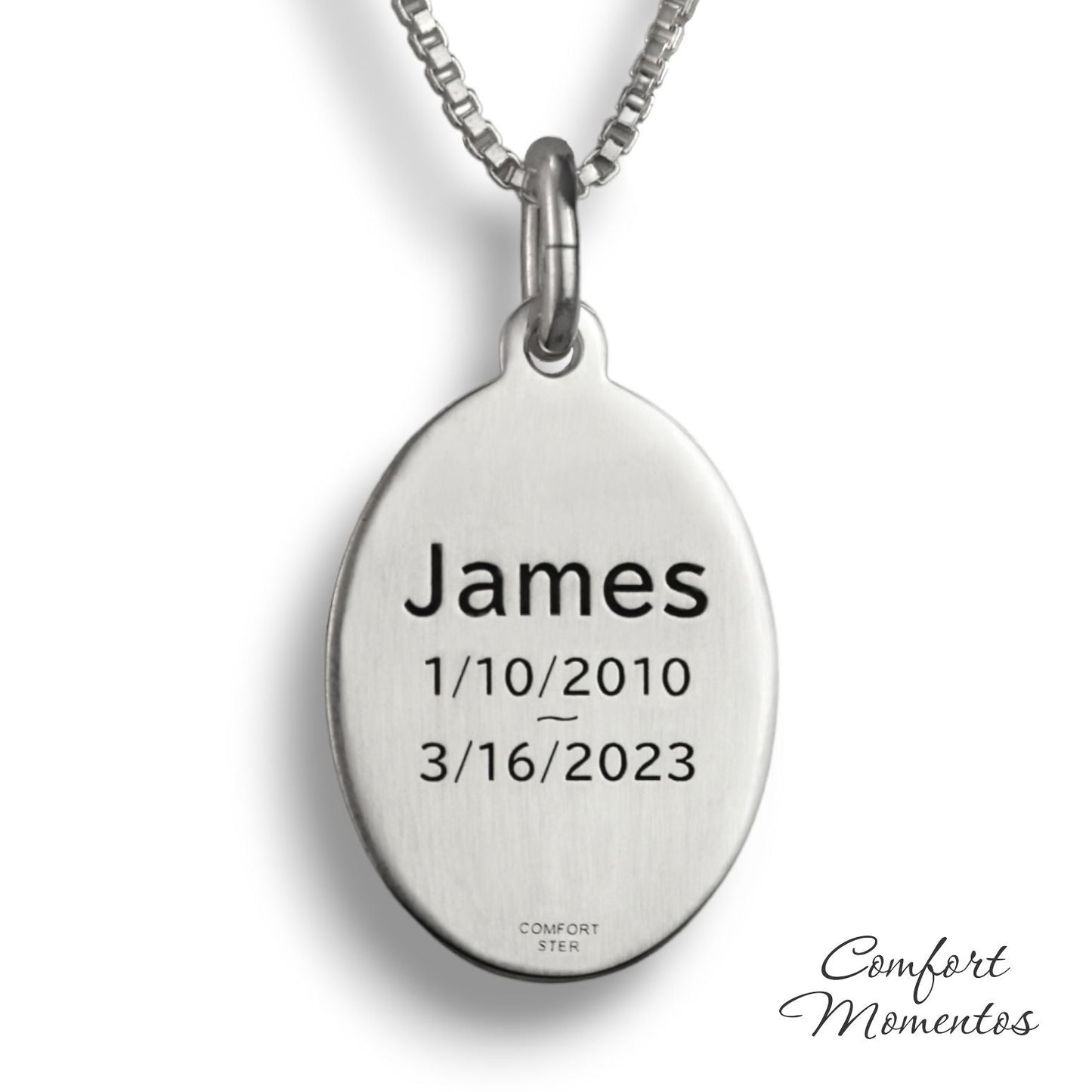 Back of silver oval necklace, with black example text engraved