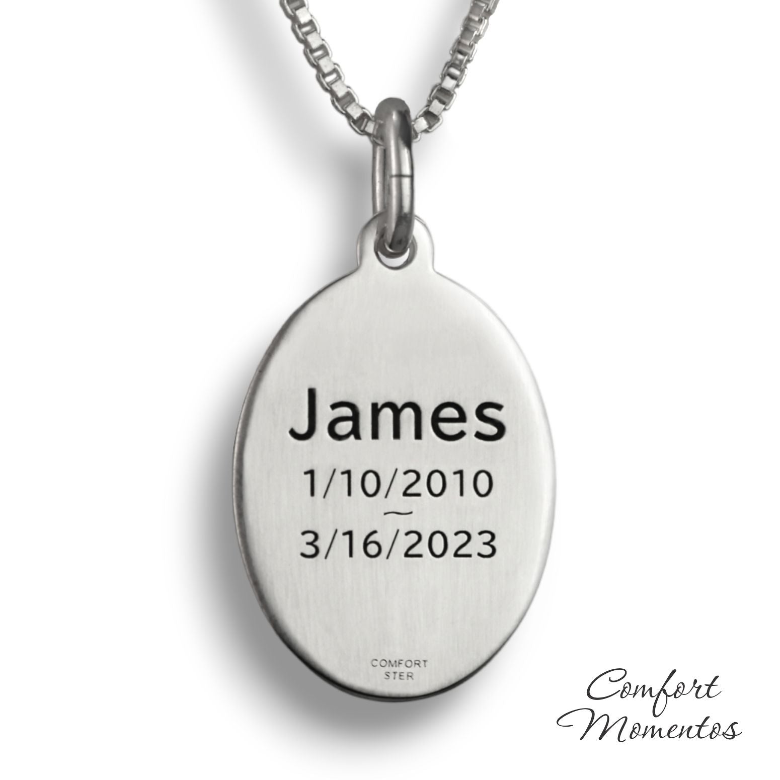 Back of silver oval necklace, with black example text engraved