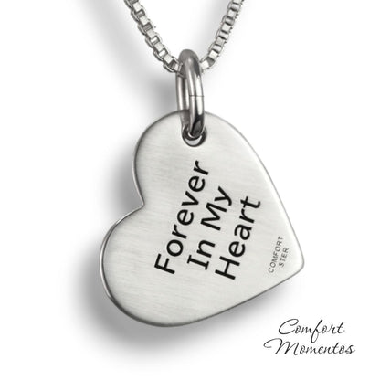 Back of silver tilted heart necklace, with black example text engraved
