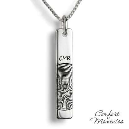 Silver vertical bar necklace engraved with a black fingerprint and initials