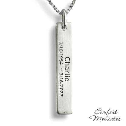 Back of silver bar necklace, with black example text engraved