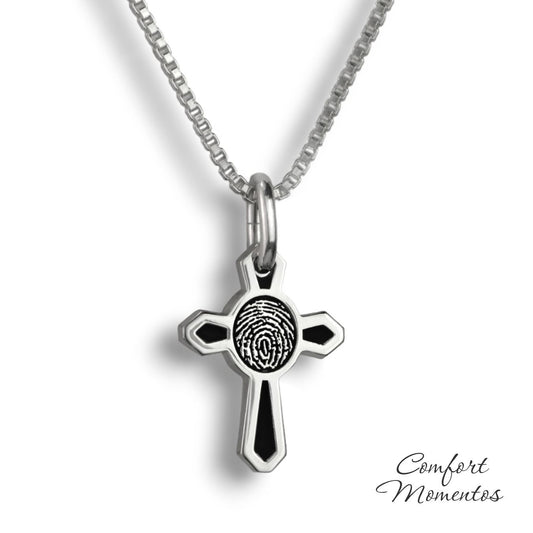 Small silver cross necklace with black fingerprint and recessed black areas