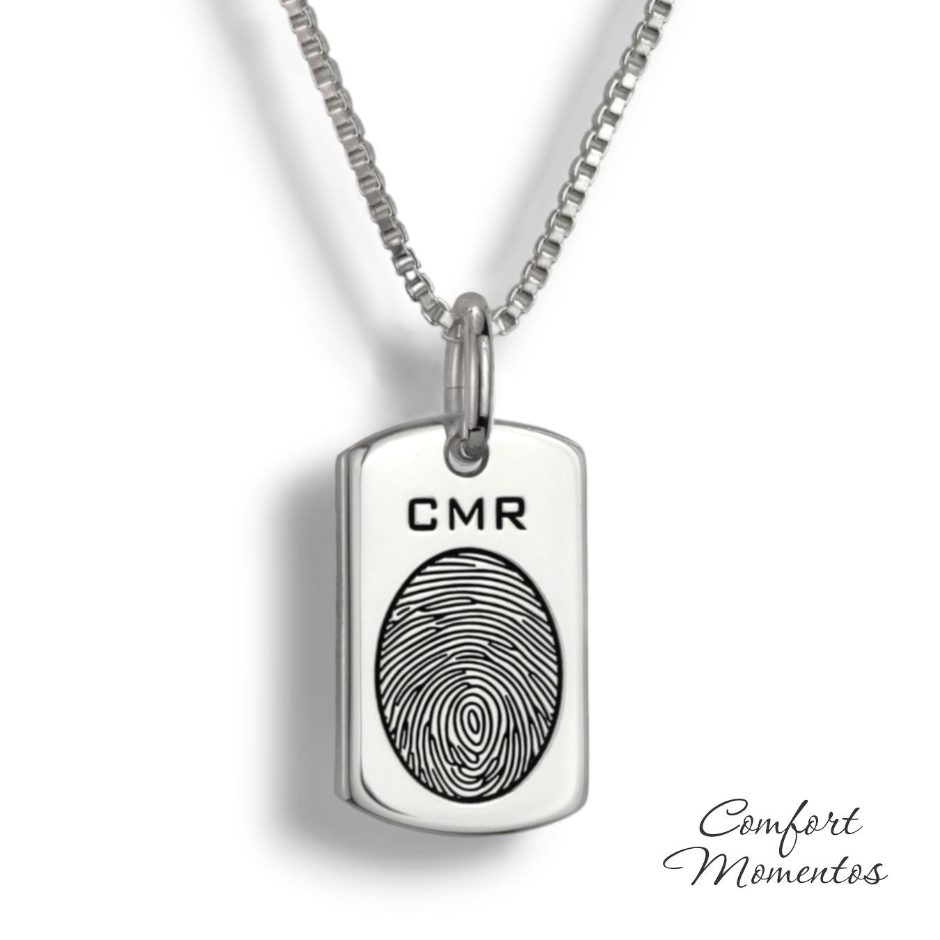 Small silver dog tag necklace with a black fingerprint and initials engraved