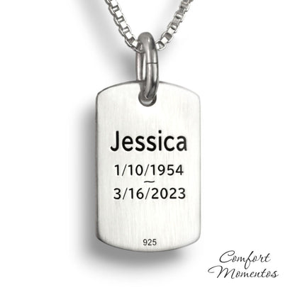 Back of small silver dog tag necklace, with black example text engraved