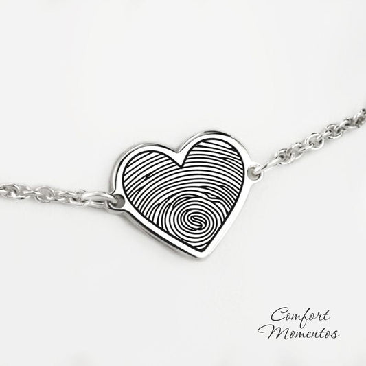 Silver heart charm bracelet engraved with a black fingerprint, with a rounded cable chain