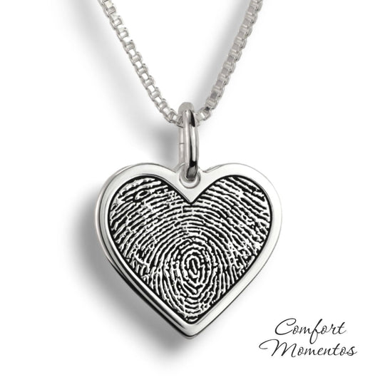 Silver heart necklace with a black fingerprint engraved