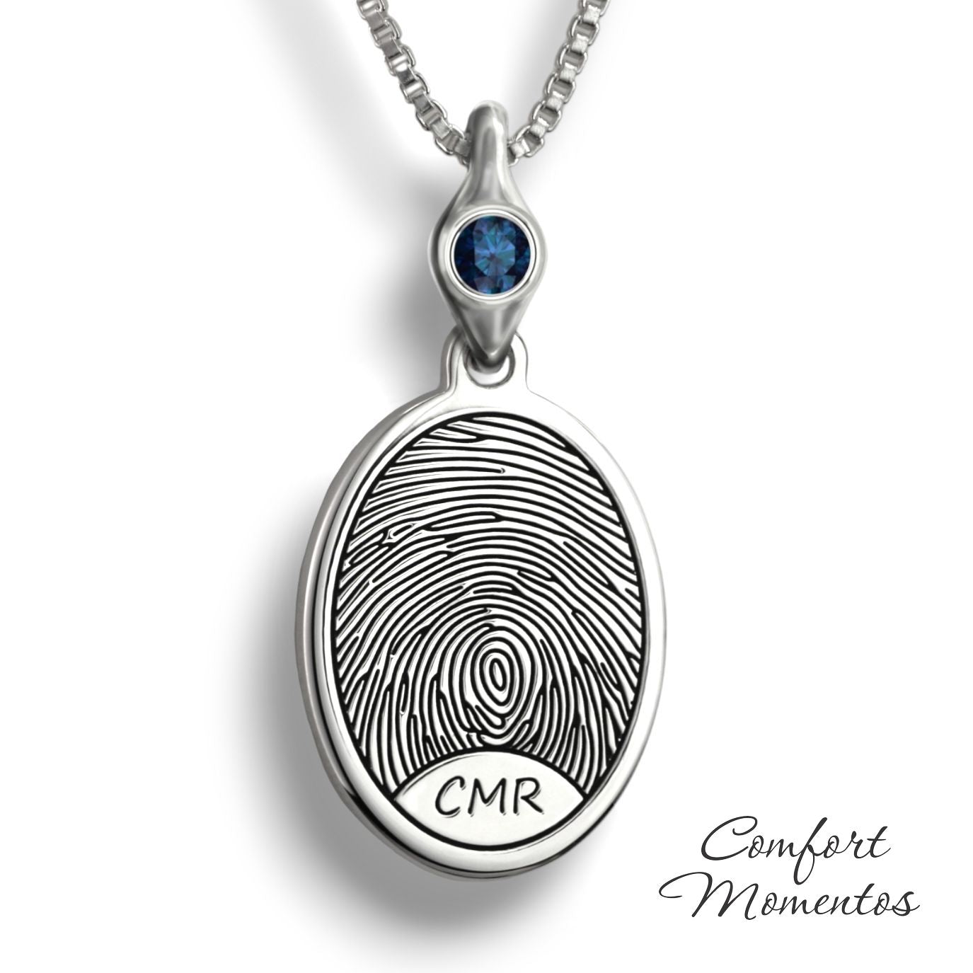 Silver oval necklace with a black fingerprint and initials engraved, with a gemstone urn