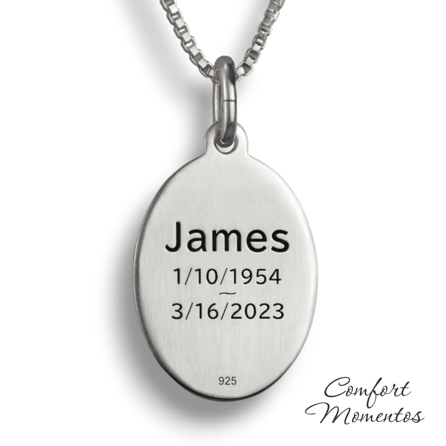 Back of silver oval necklace, with black example text engraved