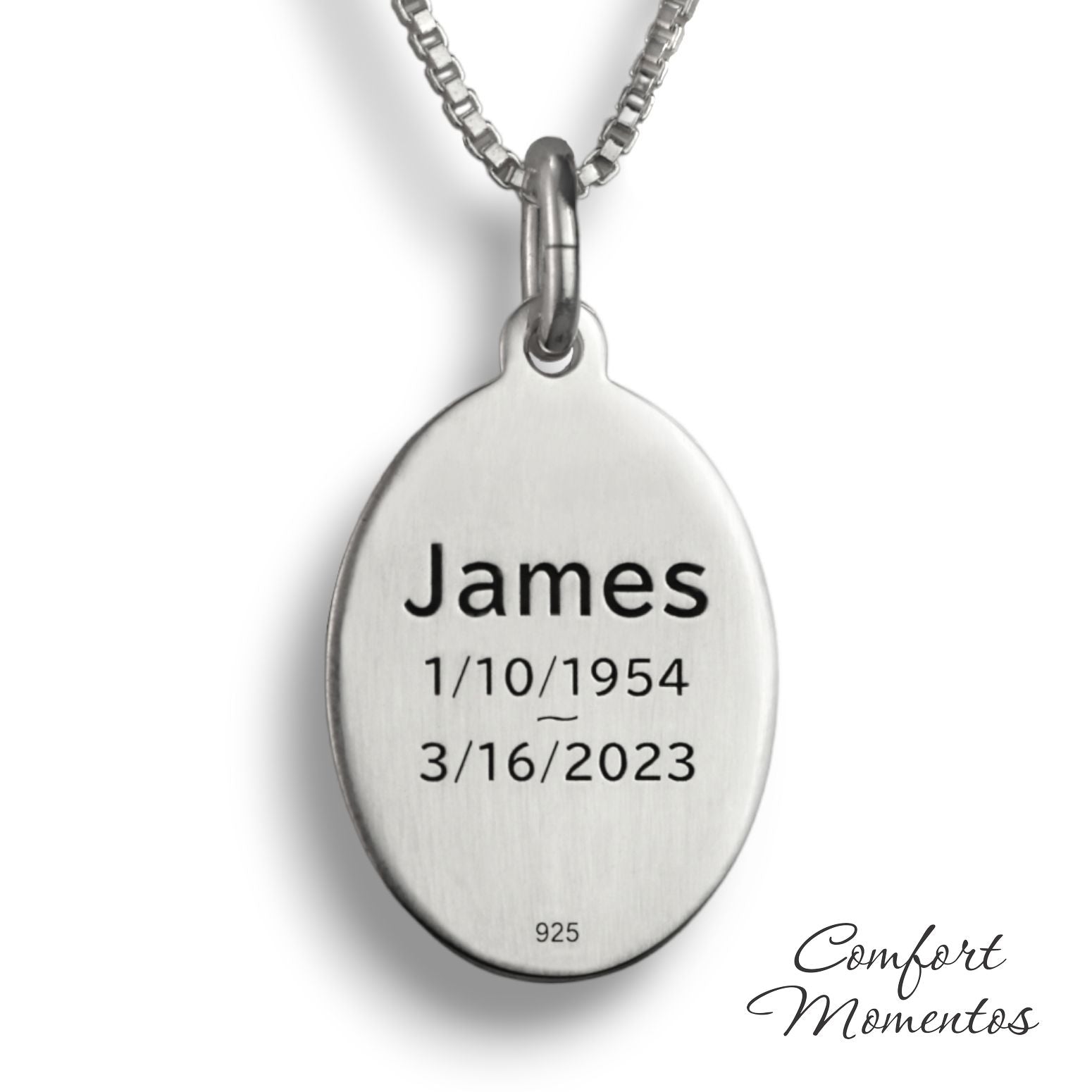 Back of silver oval necklace, with black example text engraved