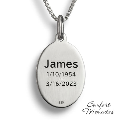 Back of silver oval necklace, with black example text engraved