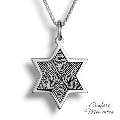 Silver star necklace with a black fingerprint engraved