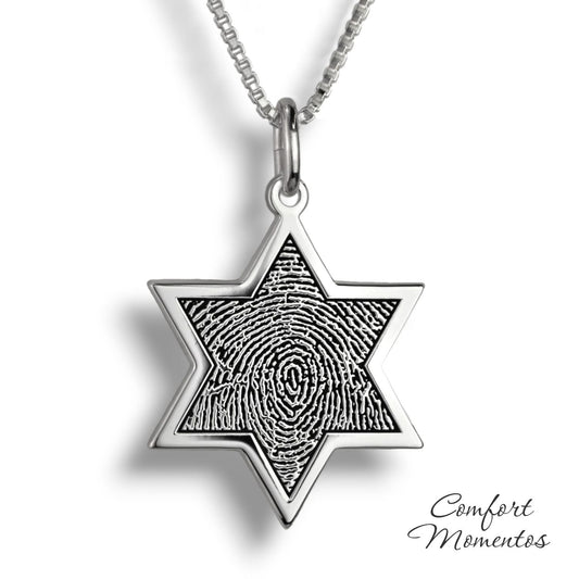 Silver star necklace with a black fingerprint engraved