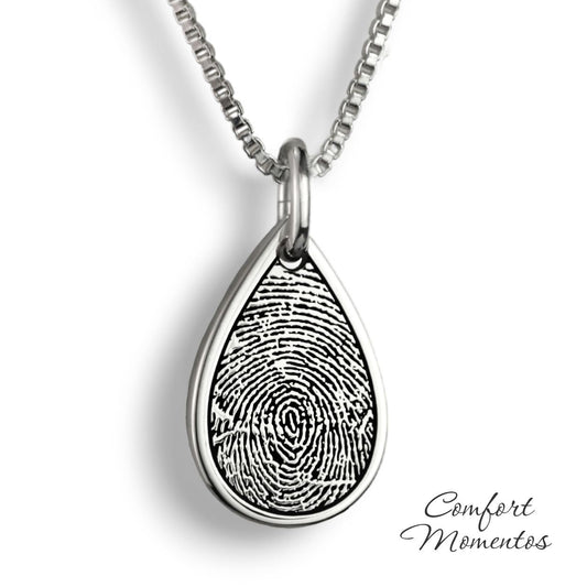 Silver teardrop necklace with a black fingerprint engraved