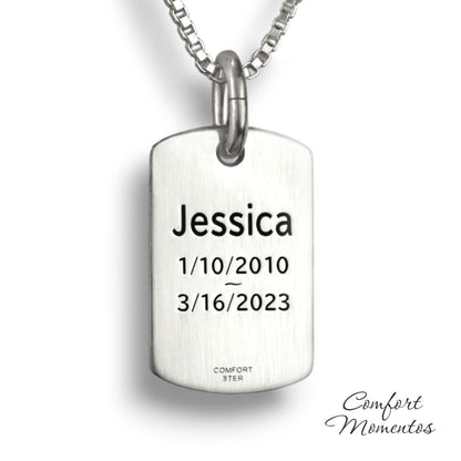 Back of small silver dog tag necklace, with black example text engraved