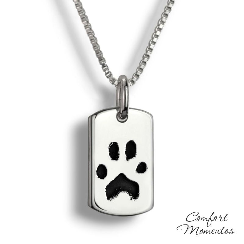 Small silver dog tag necklace with black pawprint engraving