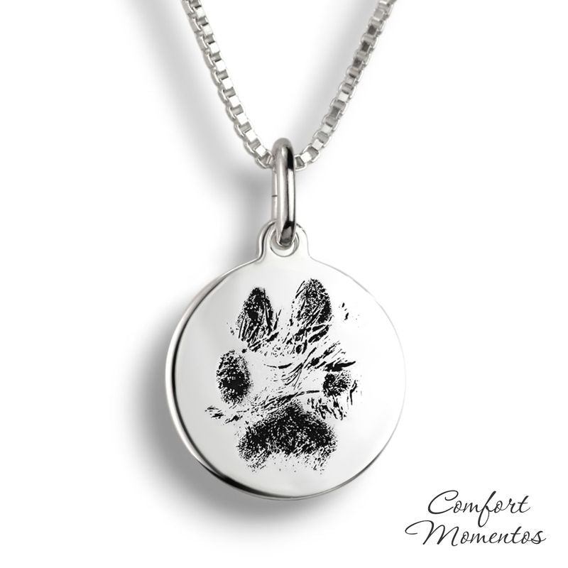 Silver round necklace with black pawprint engraving