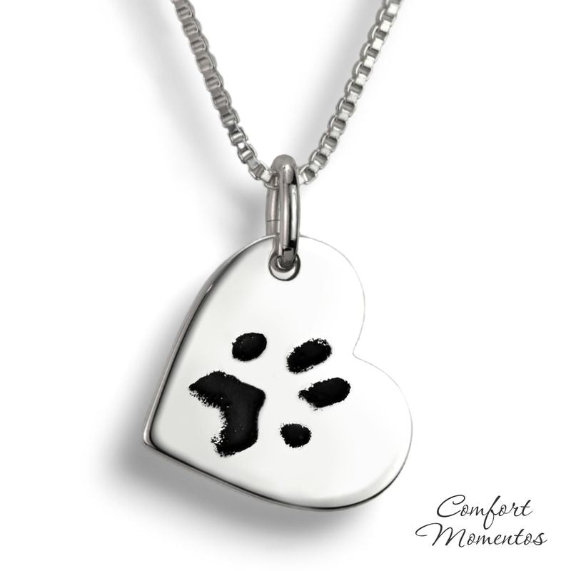 Silver heart necklace with black pawprint engraving