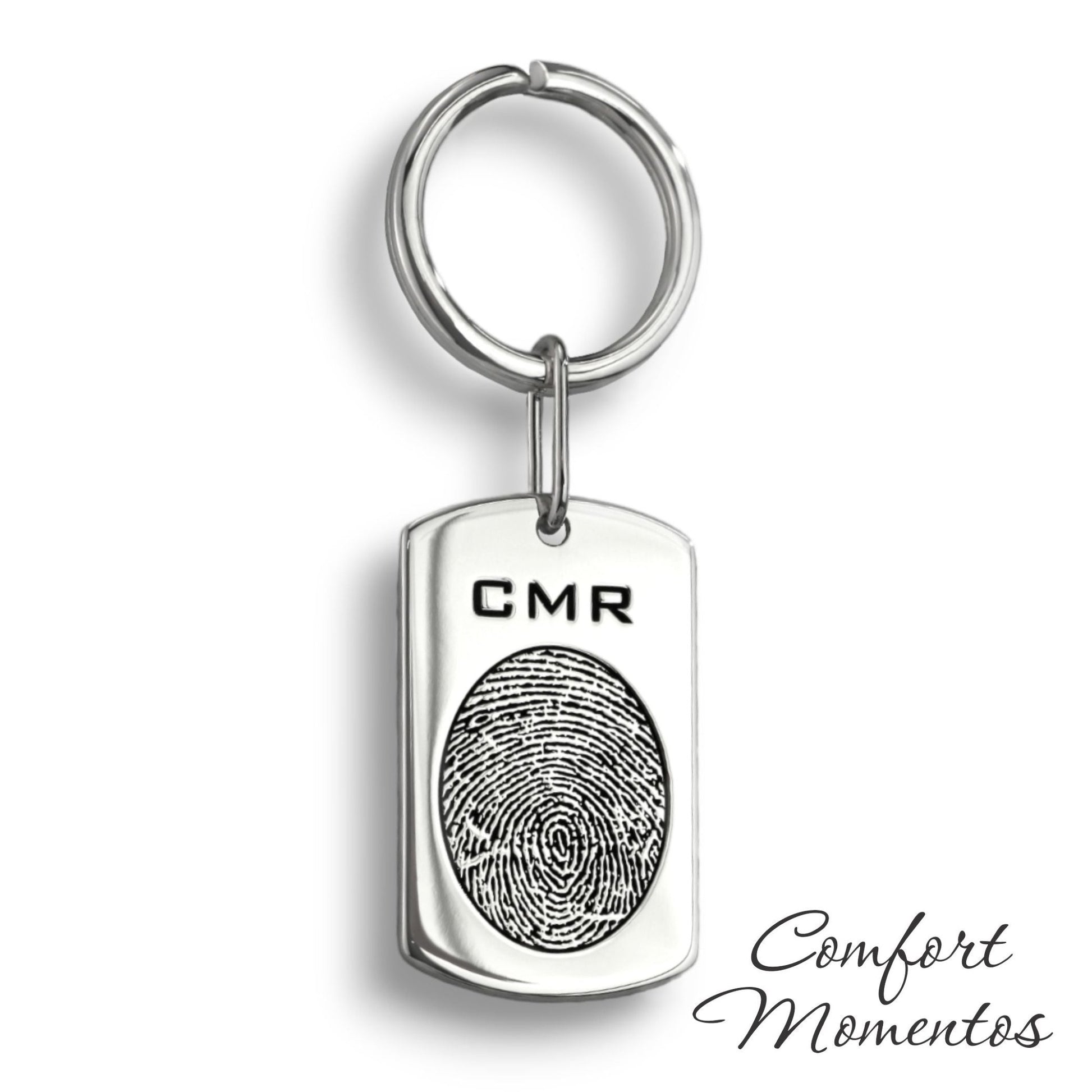 Silver dog tag keychain with a black fingerprint and initials engraved, on a round split key ring